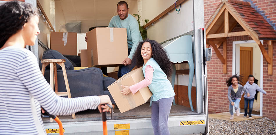 african american family unloading boxes from a moving truck